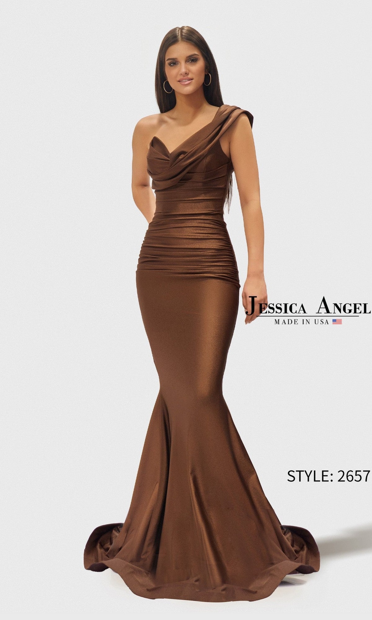 A woman wears the Jessica Angel 2657 long prom dress in chocolate, featuring a metallic brown, one-shoulder mermaid style with ruched detailing. Text on image: